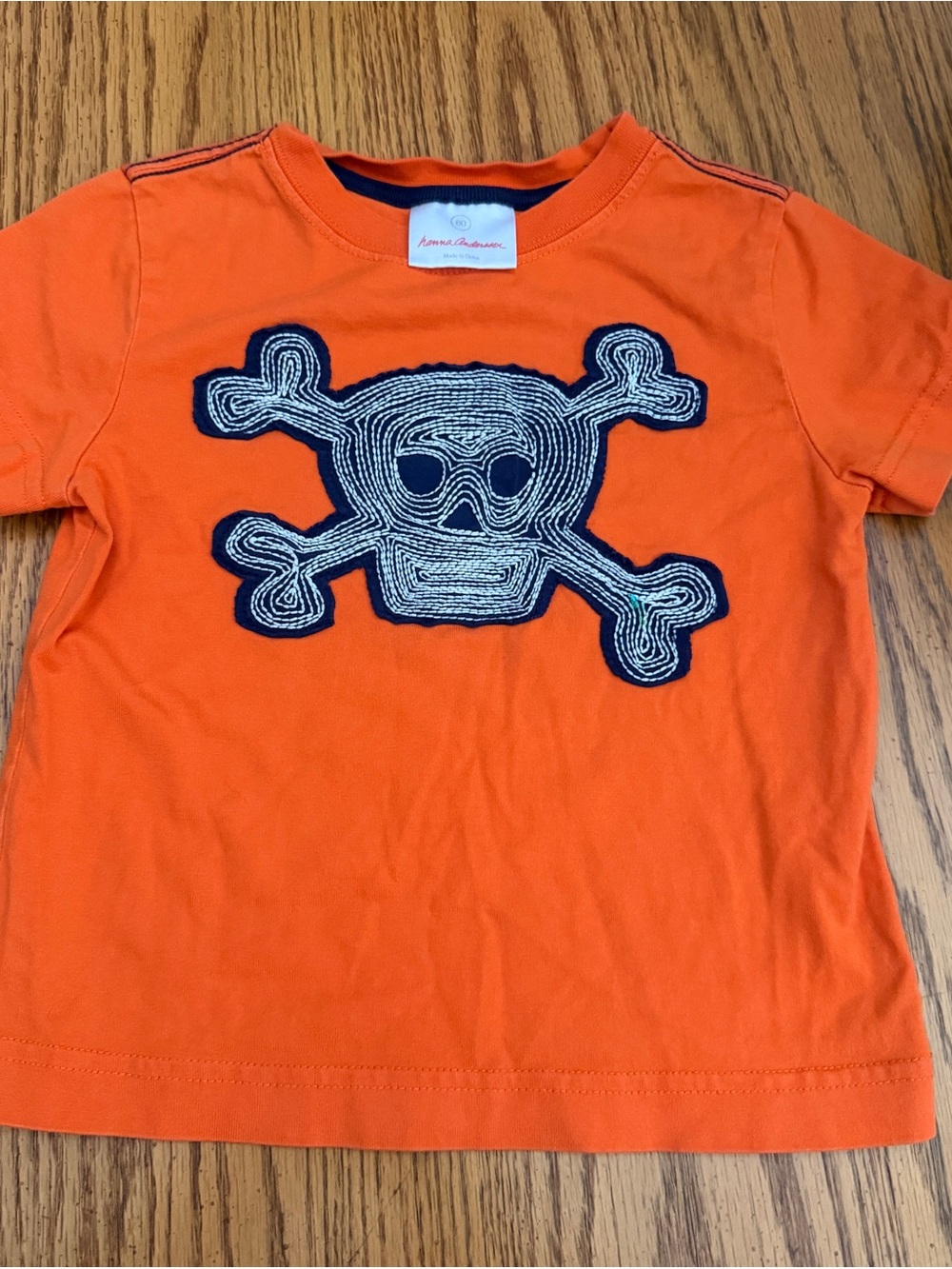 Hanna Andersson Orange Short-Sleeve Tee with Navy & Cream Skull Patch